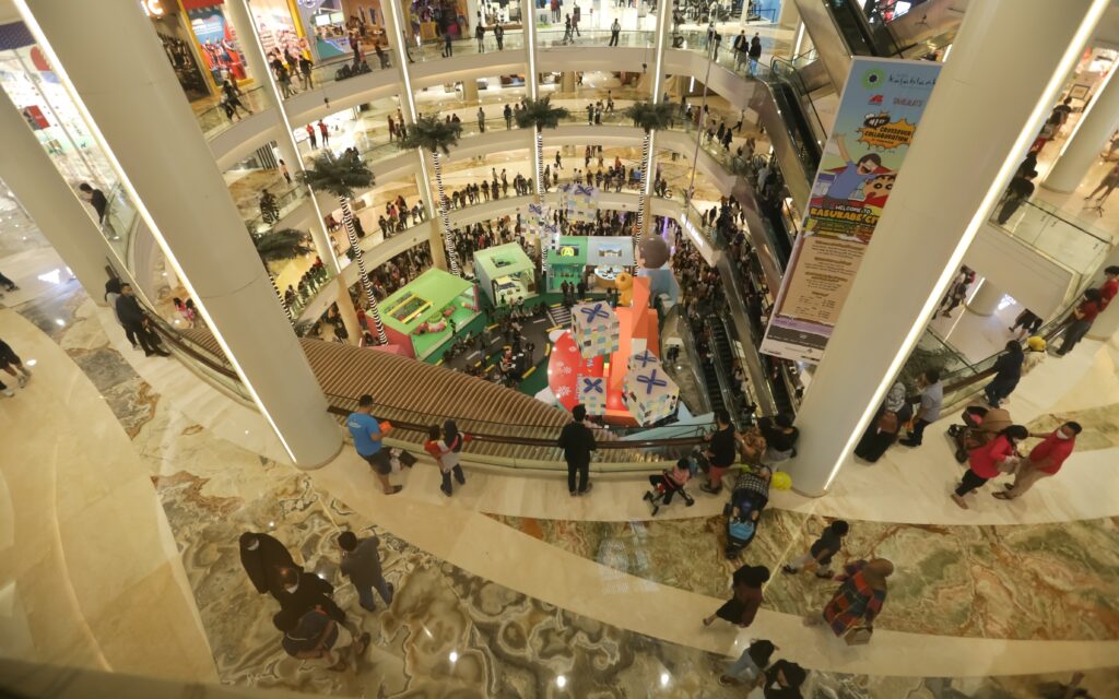 Visitors enjoy the weekend at the Kota Kasablanka Mall, passing visitors at the mall. Jakarta-Indonesia-December 2022. Prayoga Nugroho/Shutterstock
